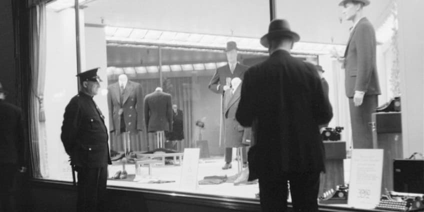 Black and white tailoring shop window scene